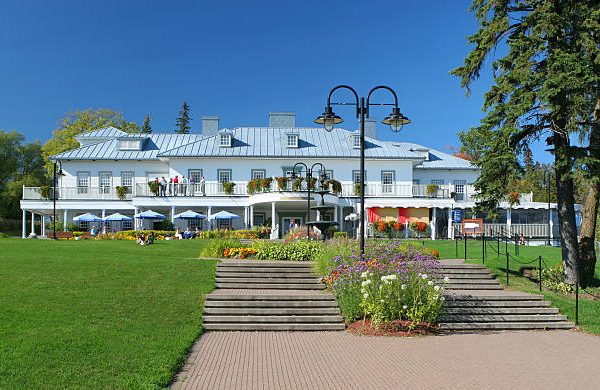 Canadian Embassy building with flags waving, representing global career opportunities in 2024.