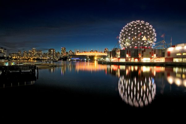 Canada skyline and office buildings representing job opportunities with visa sponsorship for international workers.